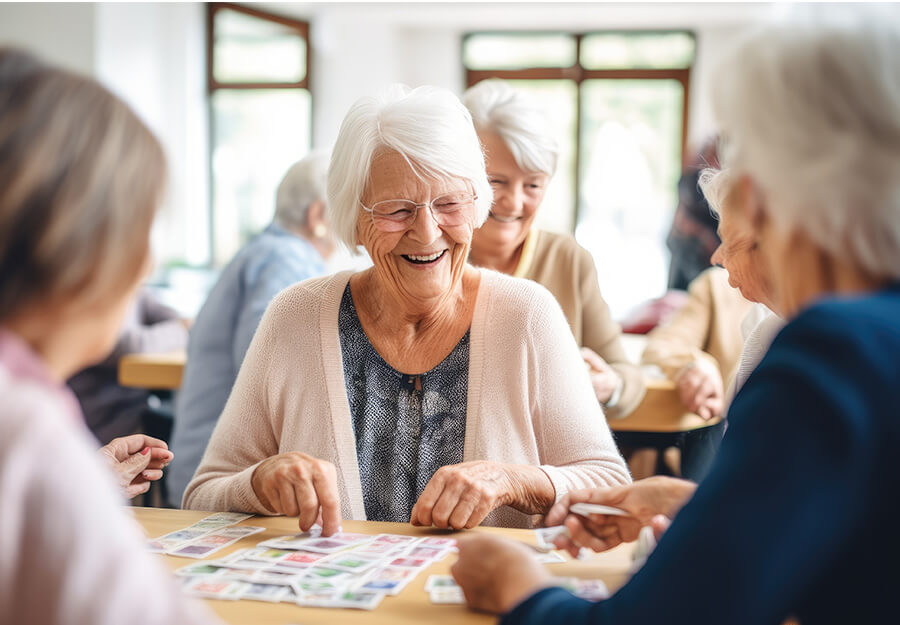 Residents enjoy a lively game in the common area of a senior living community.