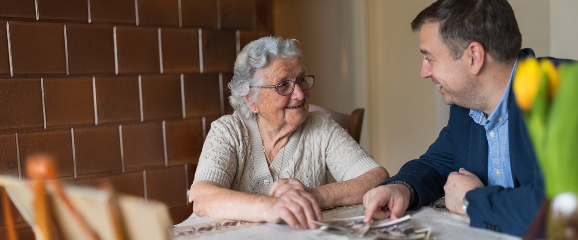Senior woman discusses senior living options with professional