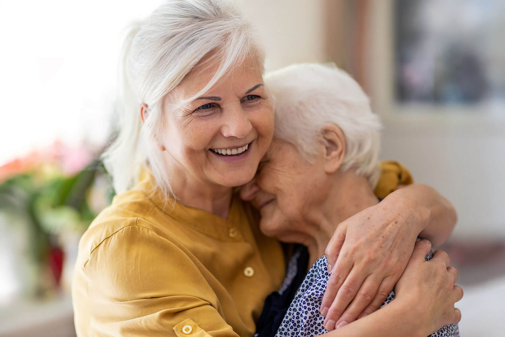 two women hugging each other