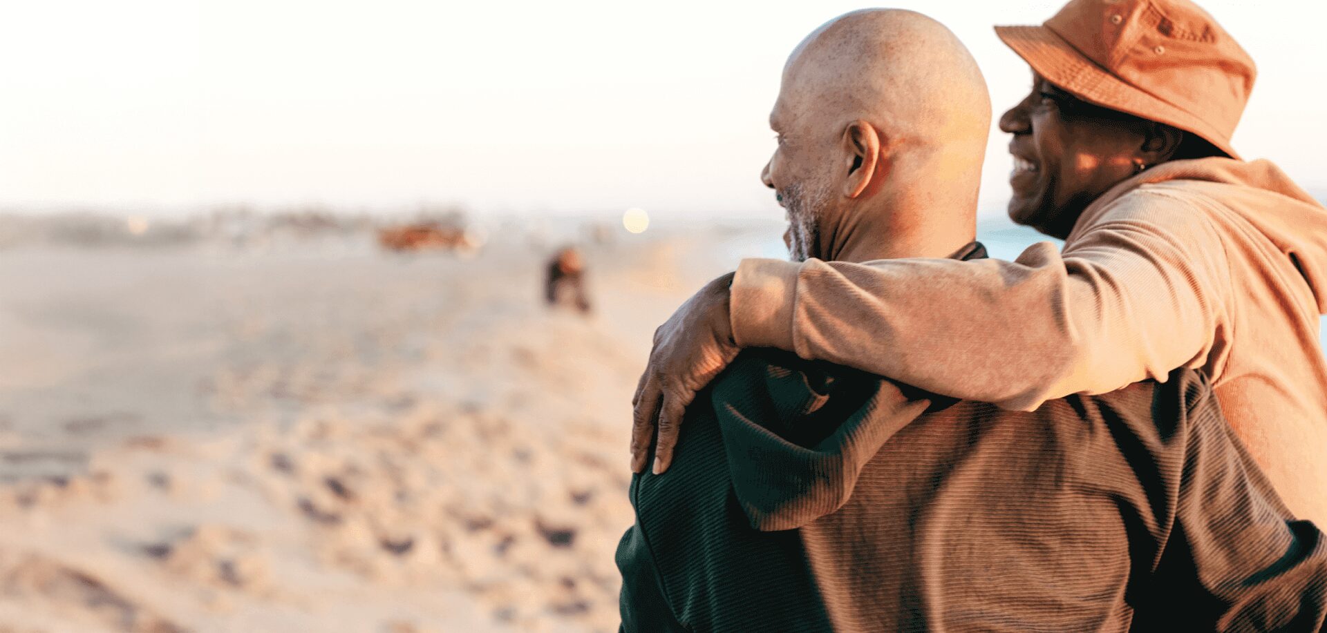 Senior couple walking on the beach